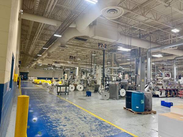 American-made LED high bay fixtures in industrial warehouse