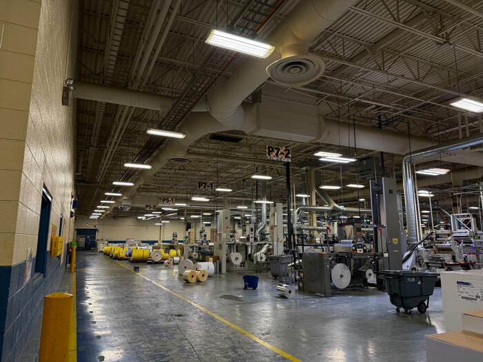 Aging metal halide industrial lighting before LED retrofit in Kentucky manufacturing plant