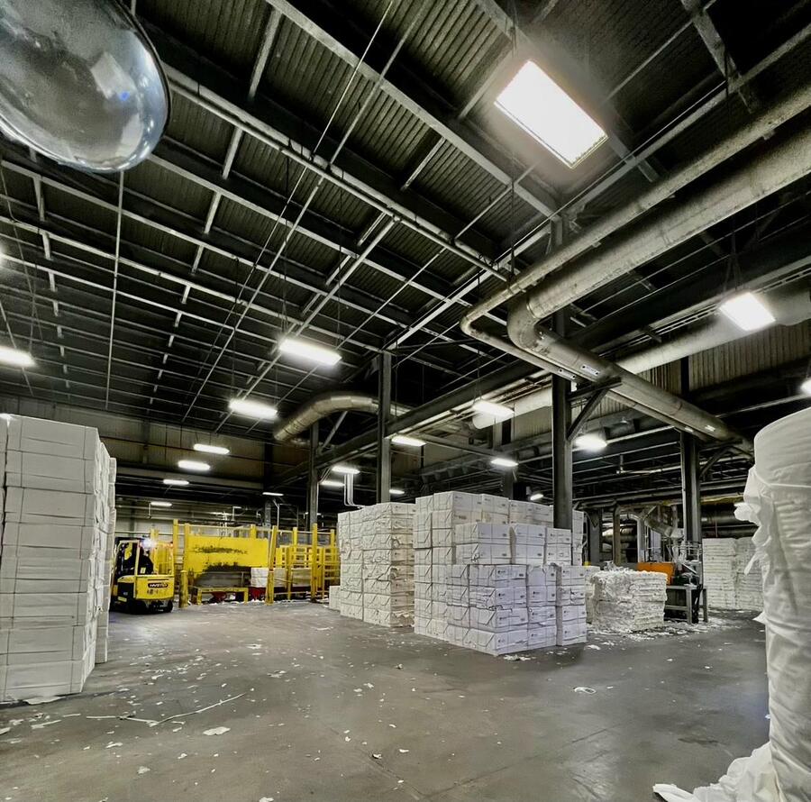 Industrial manufacturing facility before LED retrofit - dim aging HID metal halide fixtures