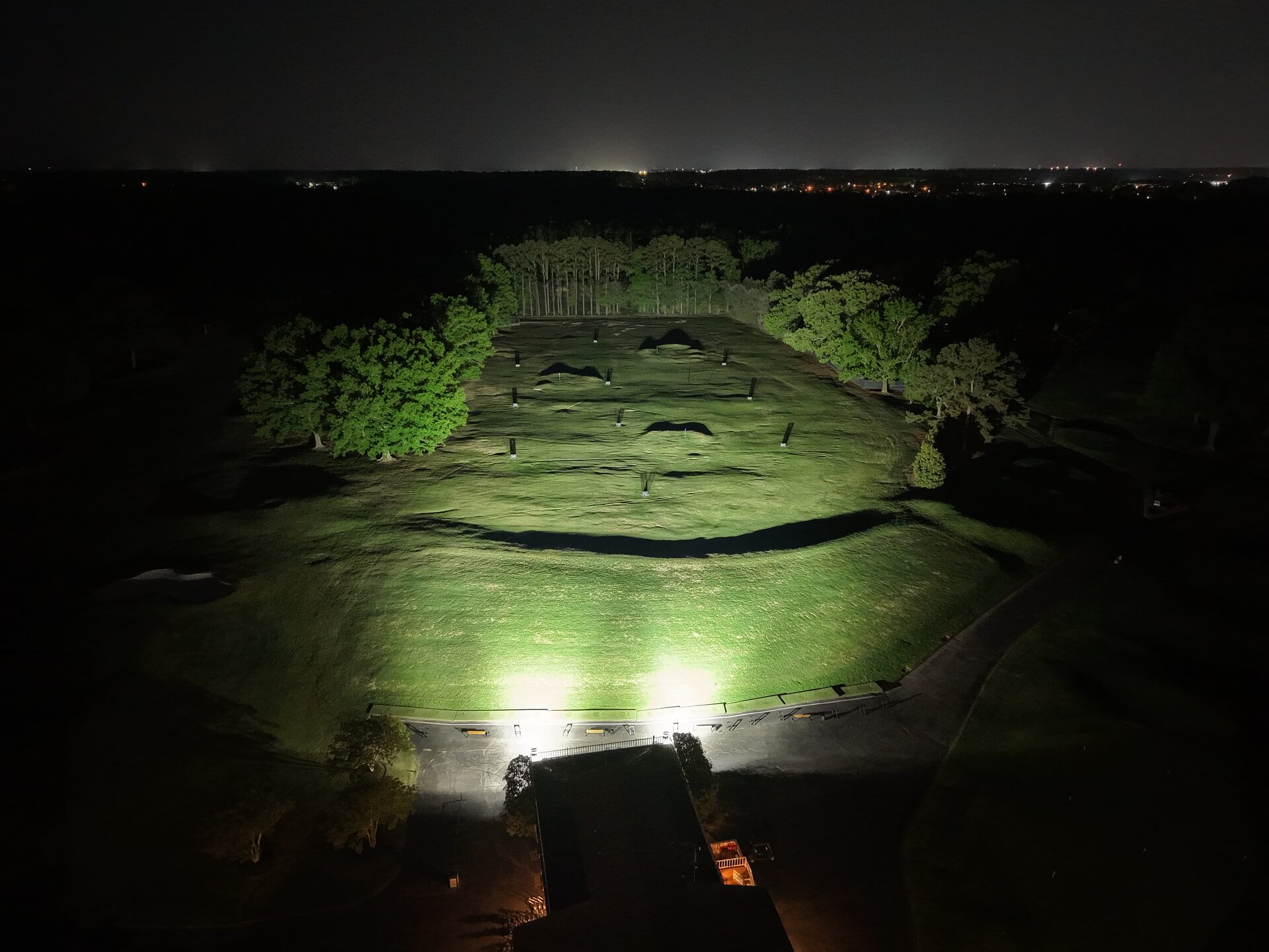 Aerial view of Windyke Country Club driving range and practice greens illuminated at night